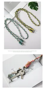 Close-up of colorful braided crossbody phone lanyard with durable metal clip and keys