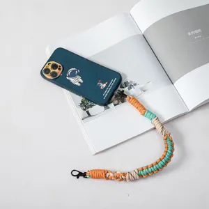 Hand-woven colorful phone lanyard wrist strap with dark blue astronaut case accessory