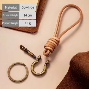 Hand-woven cowhide leather keychain featuring a vintage alloy horseshoe buckle strap