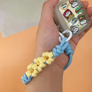 Handmade braided daisy flower phone wrist strap lanyard in blue and yellow.