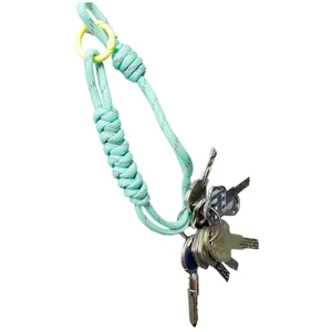 Durable mint green braided paracord wrist lanyard with yellow ring for keys and phone