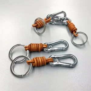 Retro handmade leather braided keychain featuring a durable silver carabiner and split ring