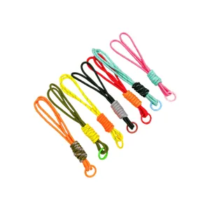 Set of seven colorful handmade woven paracord keychains with matching metal rings