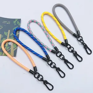 Five colorful braided wrist lanyards for phones and keys with durable black clasps