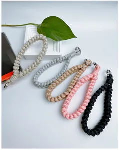 Detailed view of handmade braided phone wrist straps showing various vibrant colors.