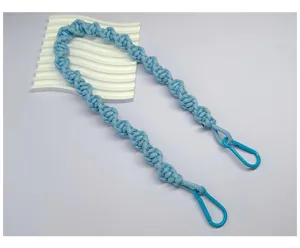 Detailed view of a light blue hand-woven braided rope shoulder strap with matching hooks.