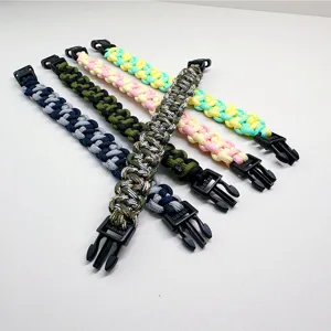 Hand-woven paracord survival bracelets in various colors with quick-release buckles