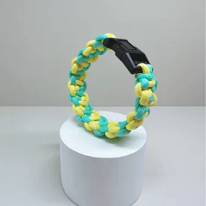 Handmade yellow and turquoise braided paracord survival bracelet with black buckle