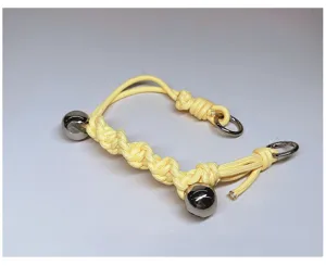 Premium hand-woven yellow paracord bag handle strap featuring metal bells and D-rings.