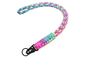 Detailed macro view of colorful braided paracord lanyard with sturdy black metal clip