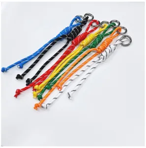 Detailed view of colorful handmade braided rope pendants for bags or phones