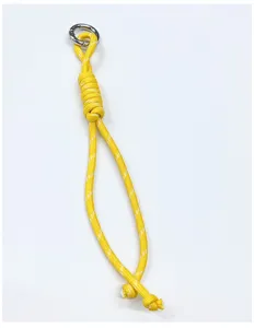 Detailed view of yellow hand-woven rope lanyard featuring a durable silver metal hook