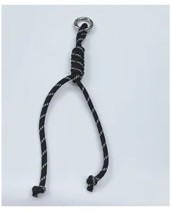Handmade black and white braided rope bag charm with silver metal ring