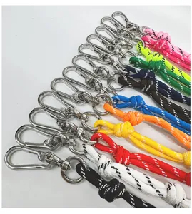 Macro view of colorful woven bag charms featuring durable silver metal climbing clips