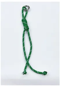 Close-up detail of handcrafted green braided rope lanyard featuring a polished silver ring.