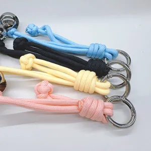 Handmade woven bag strap accessory with colorful braided rope and silver metal ring