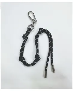 Detail view showing a black and white braided rope lanyard with a silver carabiner clip.
