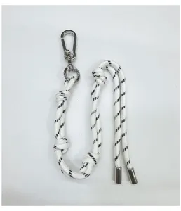 Detail view of white braided rope charm with silver carabiner and metallic tips