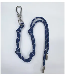 Close-up detail of blue and white braided rope keychain featuring a silver carabiner clasp