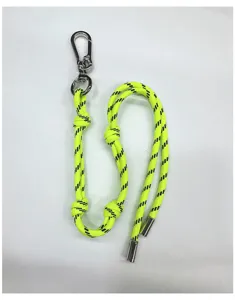 Detailed view of neon yellow braided rope bag charm featuring a silver carabiner