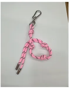 Close-up of pink braided rope keychain with silver carabiner and adjustable knots