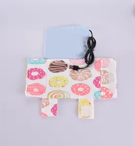 Vue détaillée d'un chauffe-biberon USB portable avec motif de beignets colorés