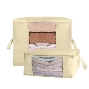 Two beige clothes storage bags with clear windows and handles for home organization