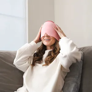 Professional pink stretchable gel cold compress head cap for migraine relief on a woman