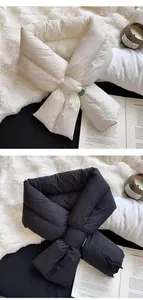 Detailed view of winter padded down-cotton cross-over scarf in white and black colors.