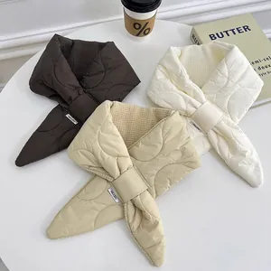 Three different colors of minimalist quilted down cotton scarves with cozy waffle lining