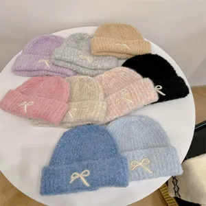 Assorted colors soft knit beanie hats with delicate bow embroidery for winter