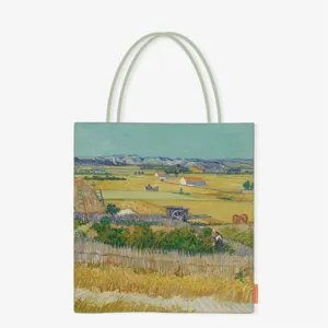 Detailed front view of a canvas tote bag printed with Van Gogh's The Harvest painting.