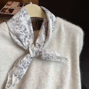 Floral cotton linen square scarf paired with a cream knit sweater for a literary style