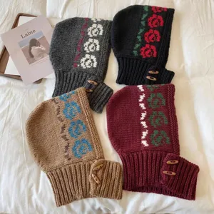 Retro Fair Isle style knitted wool Balaclava hood with rose patterns and toggle buttons.