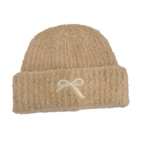 Beige knitted beanie hat for girls featuring a cute white embroidered bowknot detail