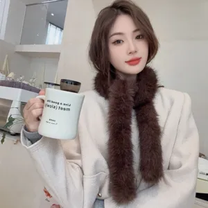 A detailed view showing the soft brown faux fur neck warmer scarf worn by model