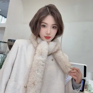 Close-up showing the fluffy texture of a beige faux fur baguette scarf for women.