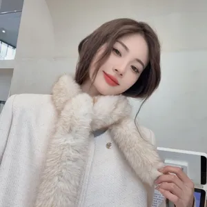 Elegant woman wearing a slim beige faux fur scarf for winter warmth and soft texture