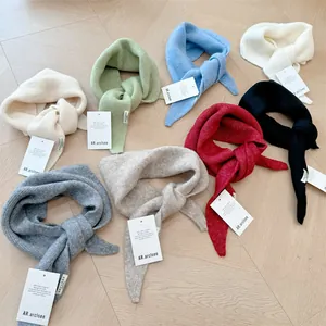Collection of soft wool knit triangular scarves in various stylish colors for women