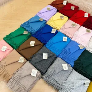 Overview of multiple solid-colored Australian wool scarves in various vibrant colors