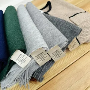 Detail of 100% Australian wool scarves showing material texture and fabric content labels.