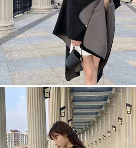 Close-up view of the black and gray reversible oversized poncho shawl material.