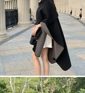 Detail view of a stylish reversible black and grey oversized shawl poncho for women