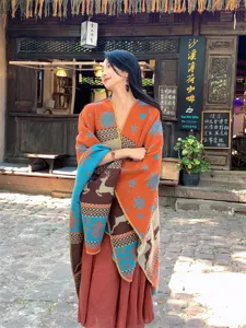 Women's oversized knit shawl wrap with elegant ethnic deer and snowflake patterns in winter