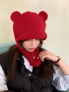 Cozy red winter knitted beanie with cute bear ears and warm ear flaps for women