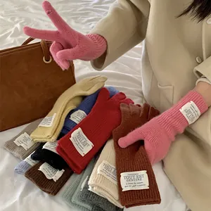 Soft women's knitted touchscreen gloves in various colors for stylish winter warmth