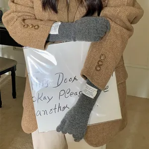 Warm winter gray knitted long gloves with touchscreen fingertips for women style