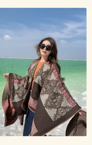 Elegant bohemian ethnic pattern knitted shawl poncho for women shown in outdoor lifestyle setting
