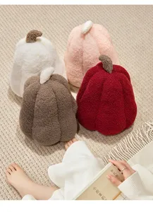 Detailed view of cozy sherpa pumpkin plush pillows in various warm autumn colors