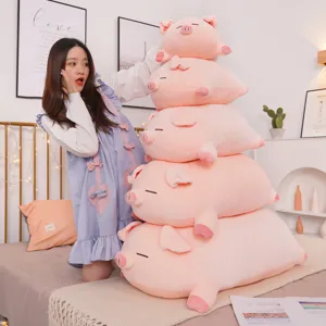 Cute pink pig plushies in five sizes stacked, ideal for nursery or bedroom decor.